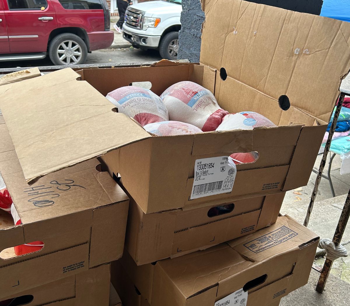 Open boxes of turkeys ready for the Thanksgiving basket giveaway