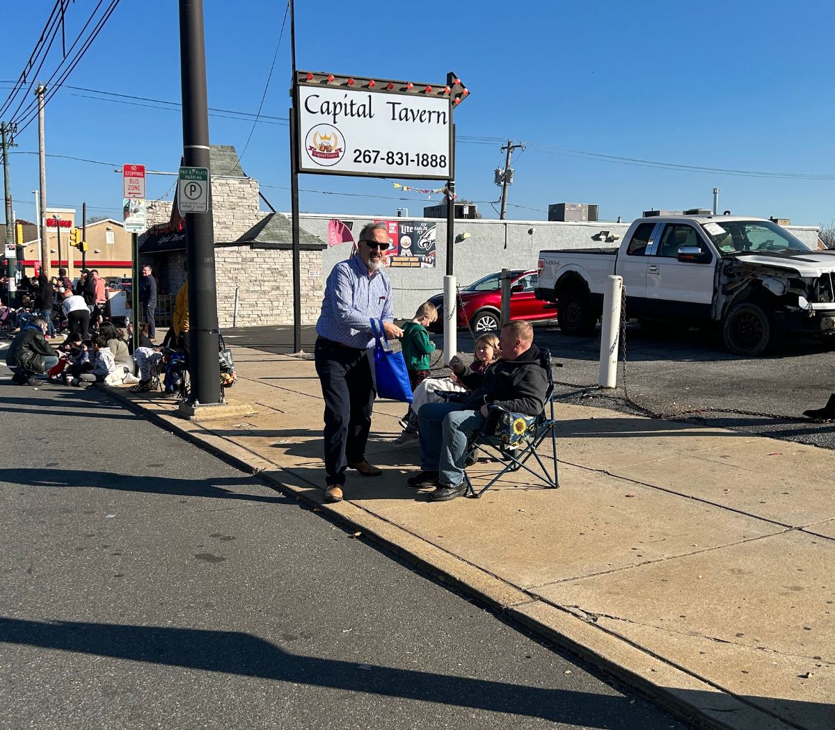 Spectrum walks in the Mayfair Thanksgiving Parade