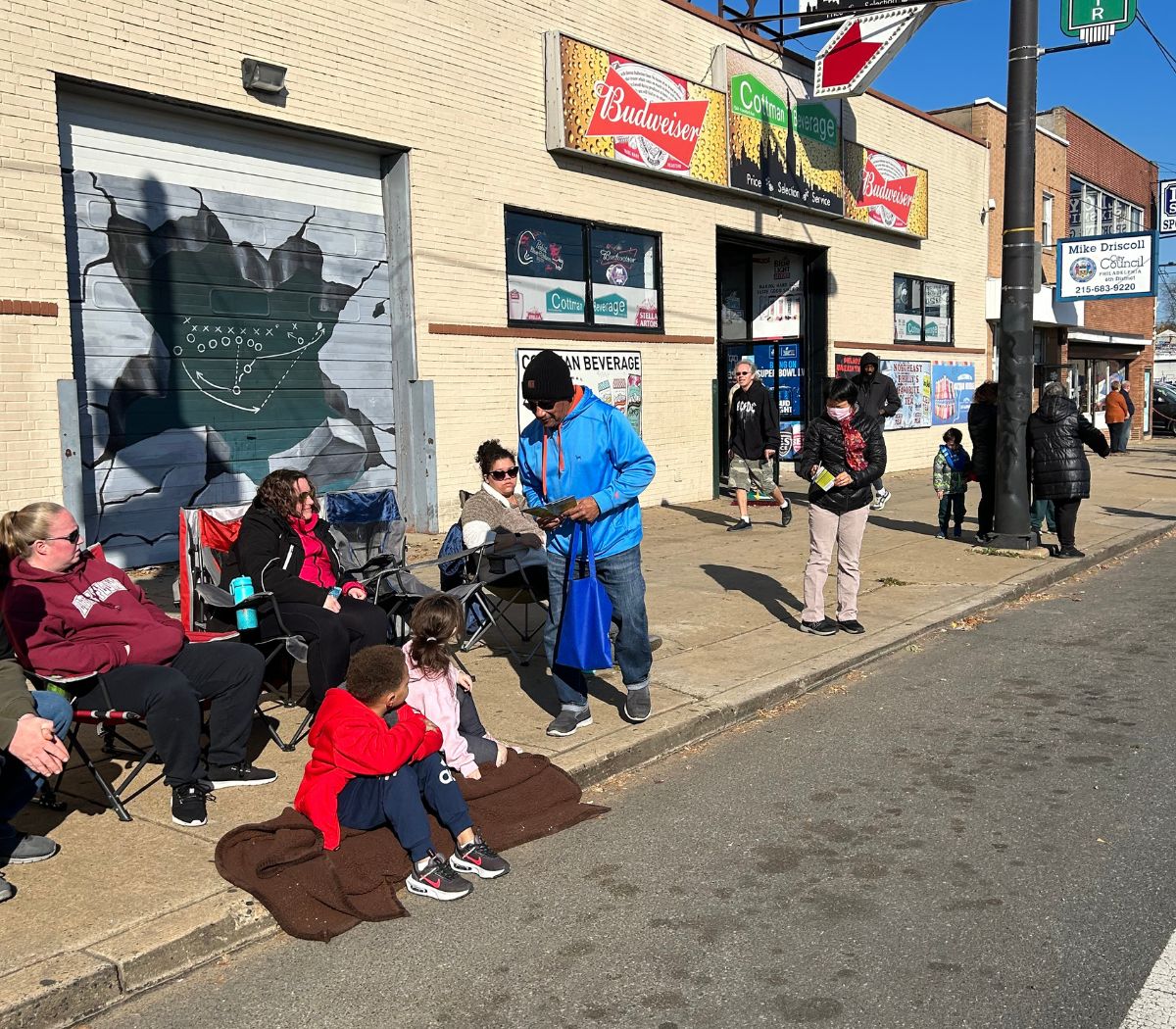 Families watch the Mayfair Thanksgiving Parade