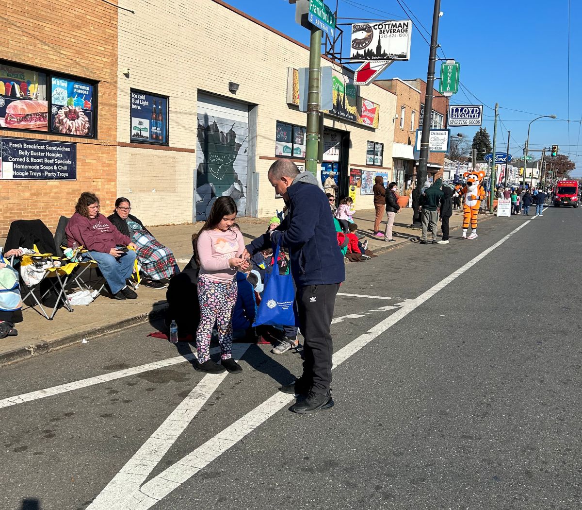 Parade-goers line the street in Mayfair
