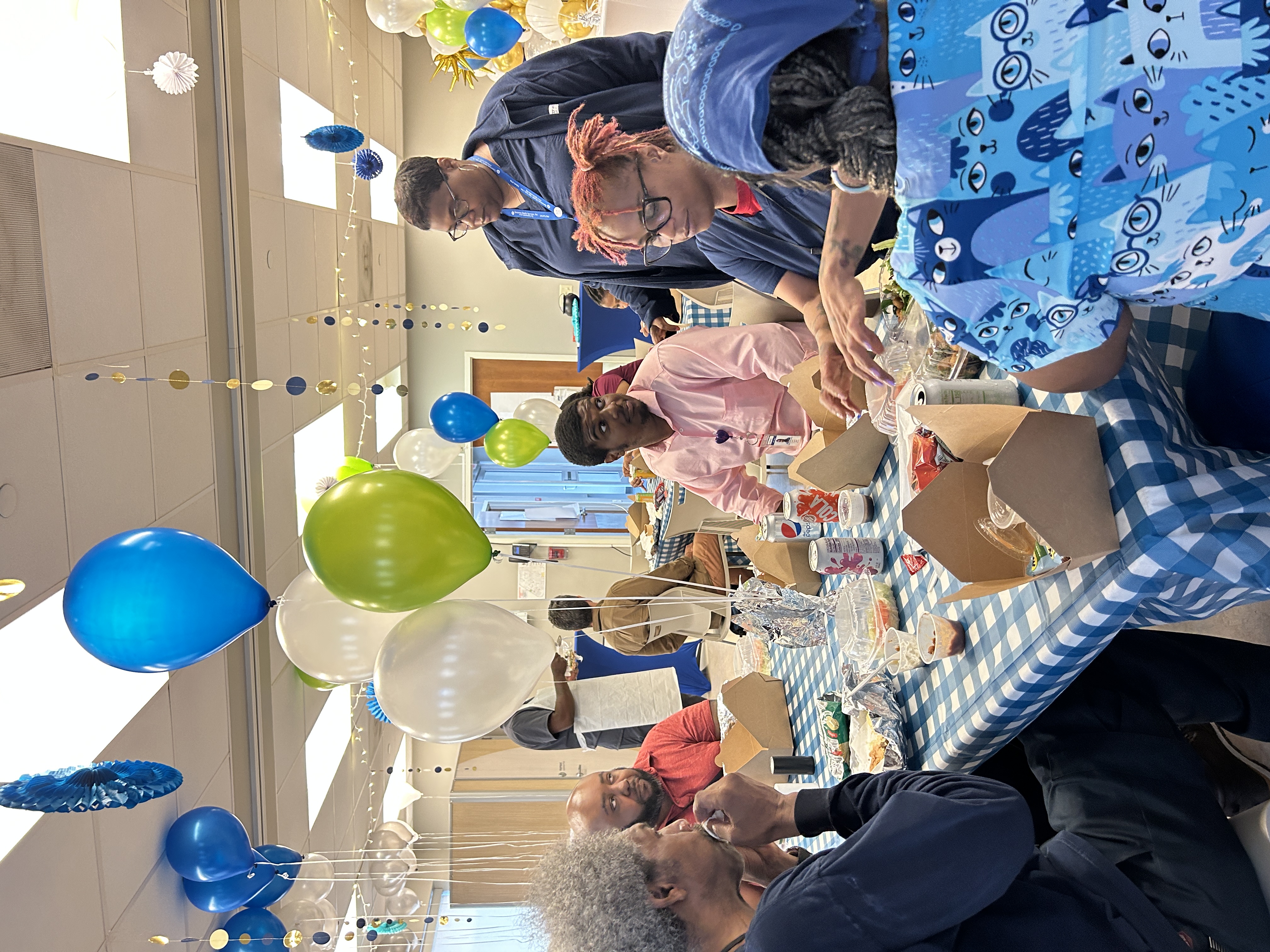 Guests fill their plates at the community barbecue
