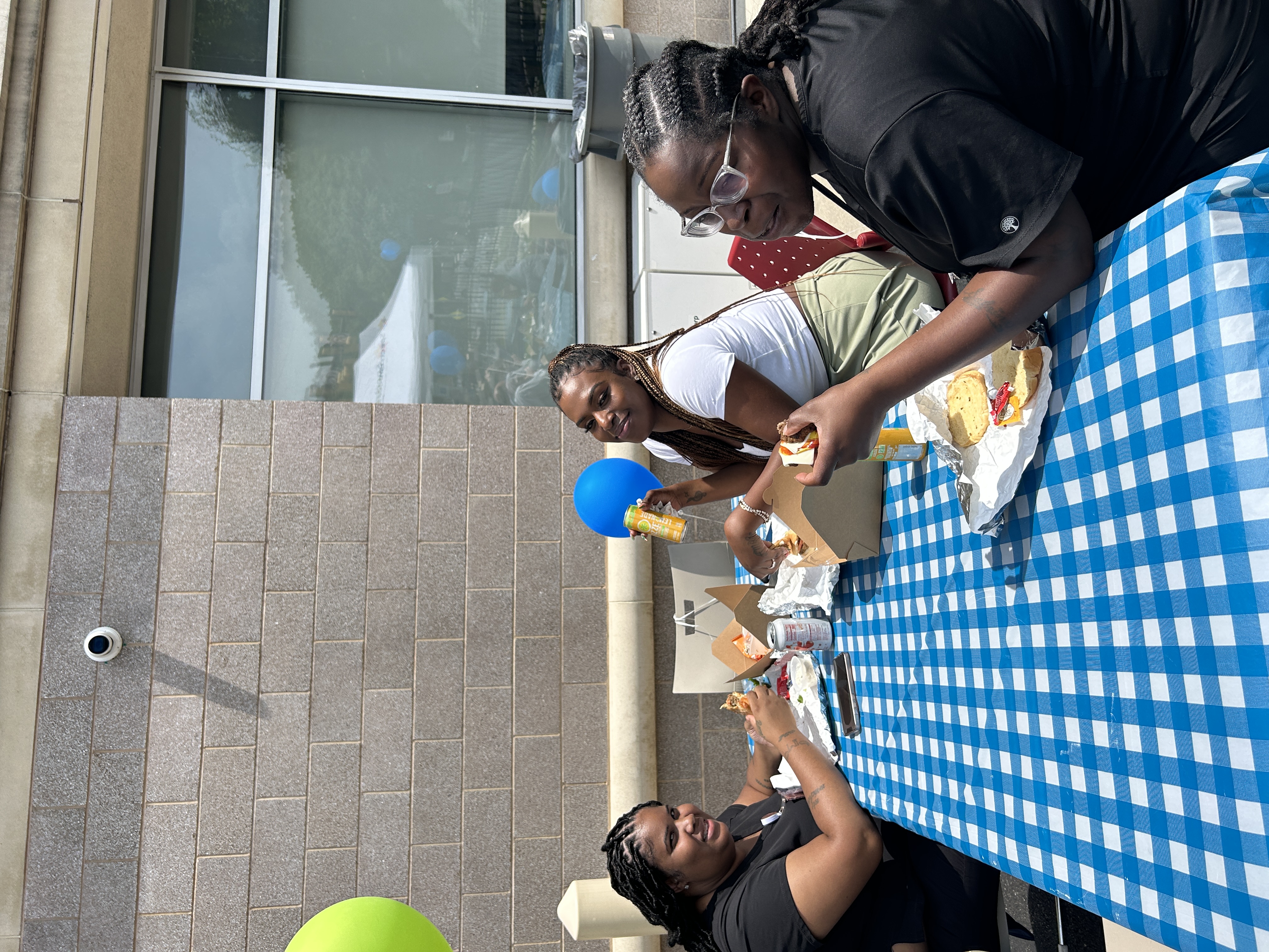 Guests eat together at a checkered table