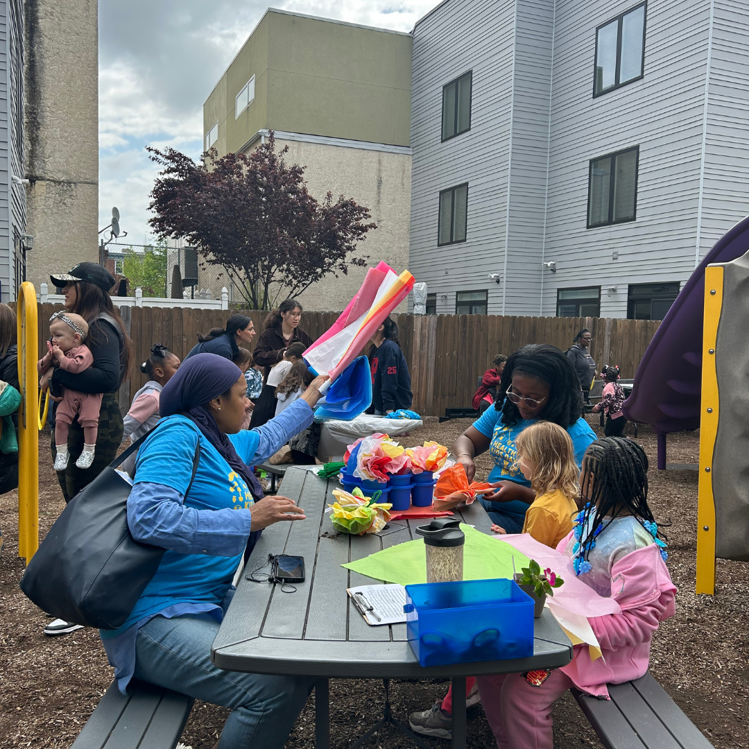 Kids and families at picnic tables at Healthy Kids Day