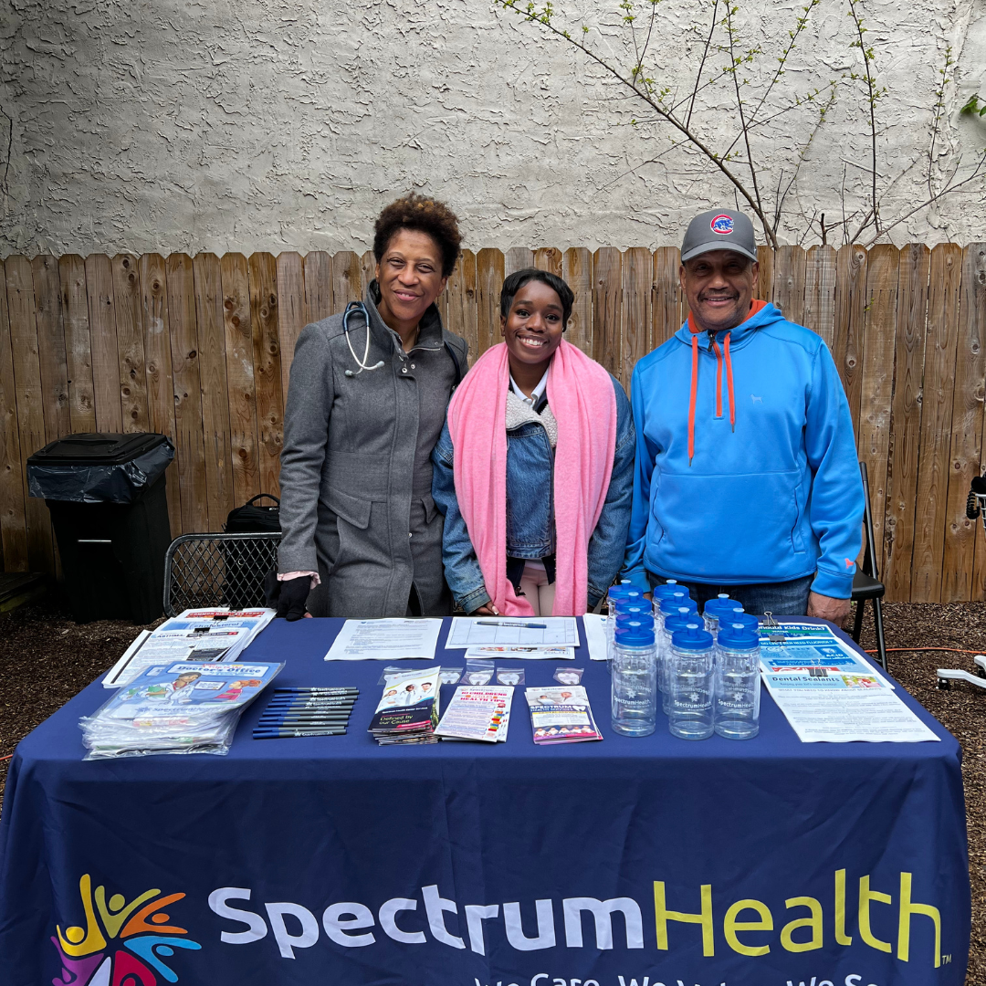 Spectrum staff at the Spectrum Health table at Healthy Kids Day