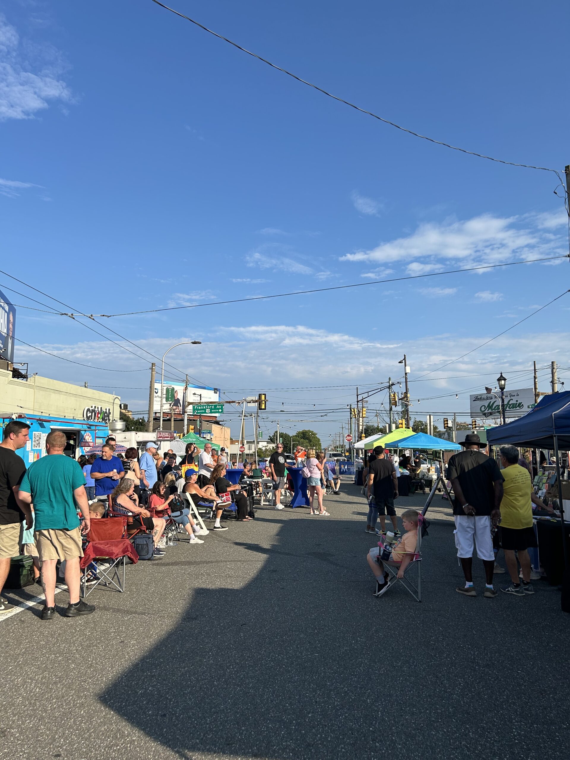 Crowds walk along the night market street