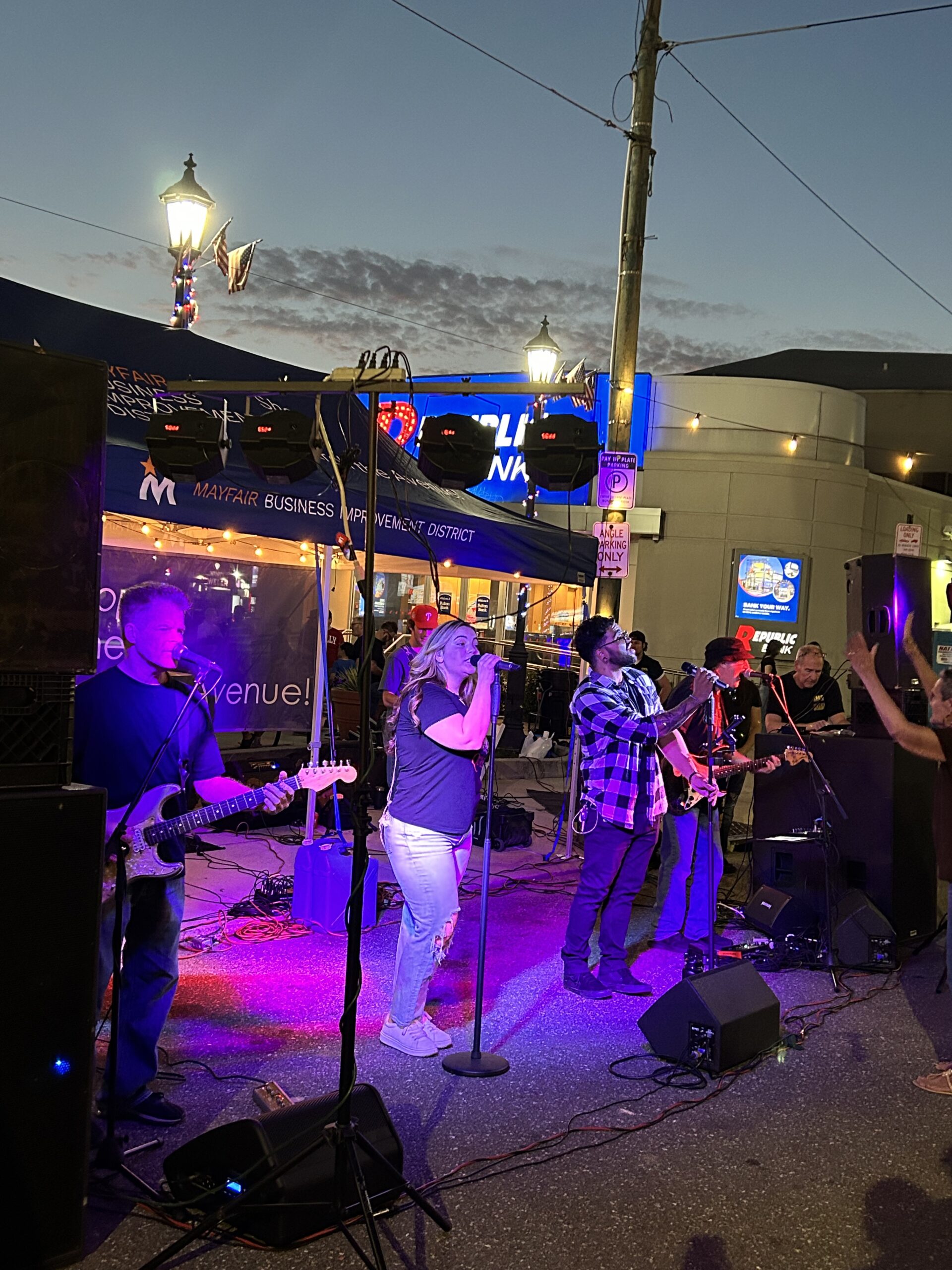 A band plays on stage at the night market