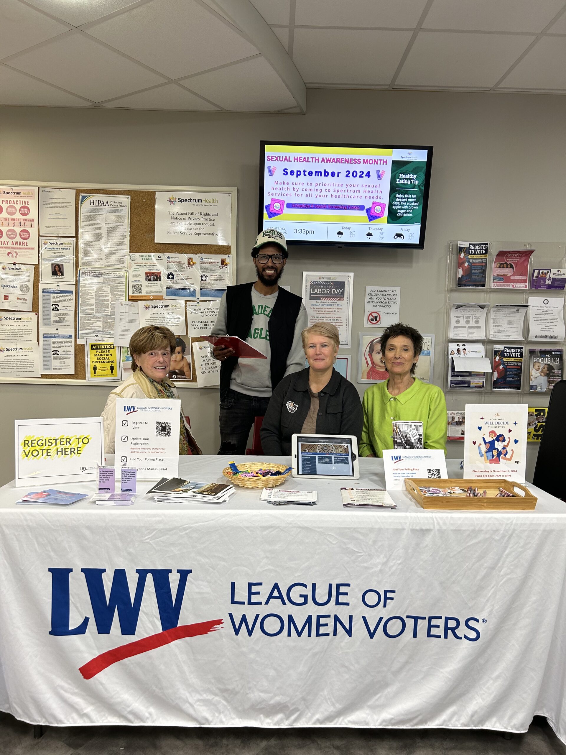 Volunteers at the League of Women Voters table