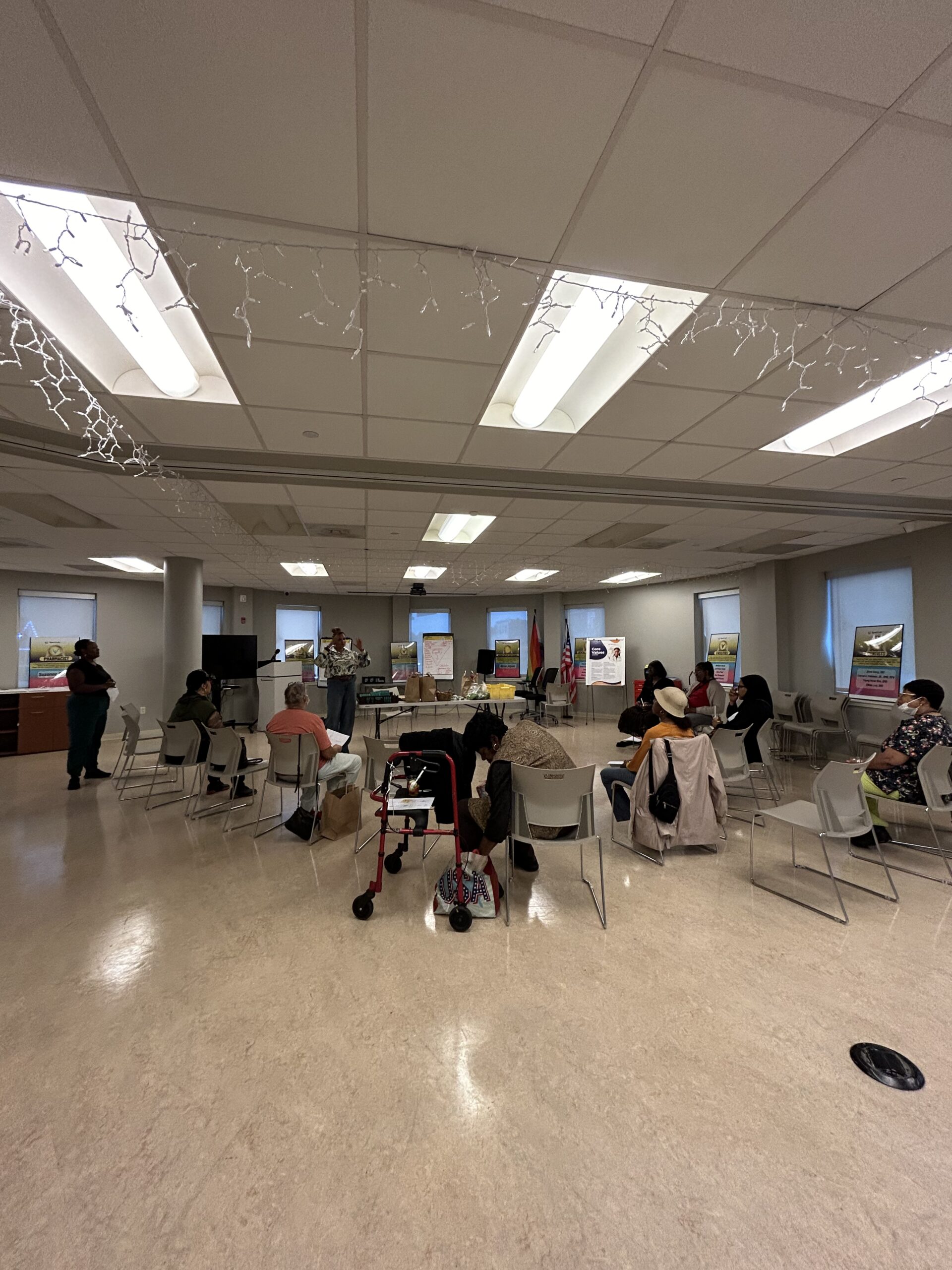 Guests sit in a large room during the Energy Series