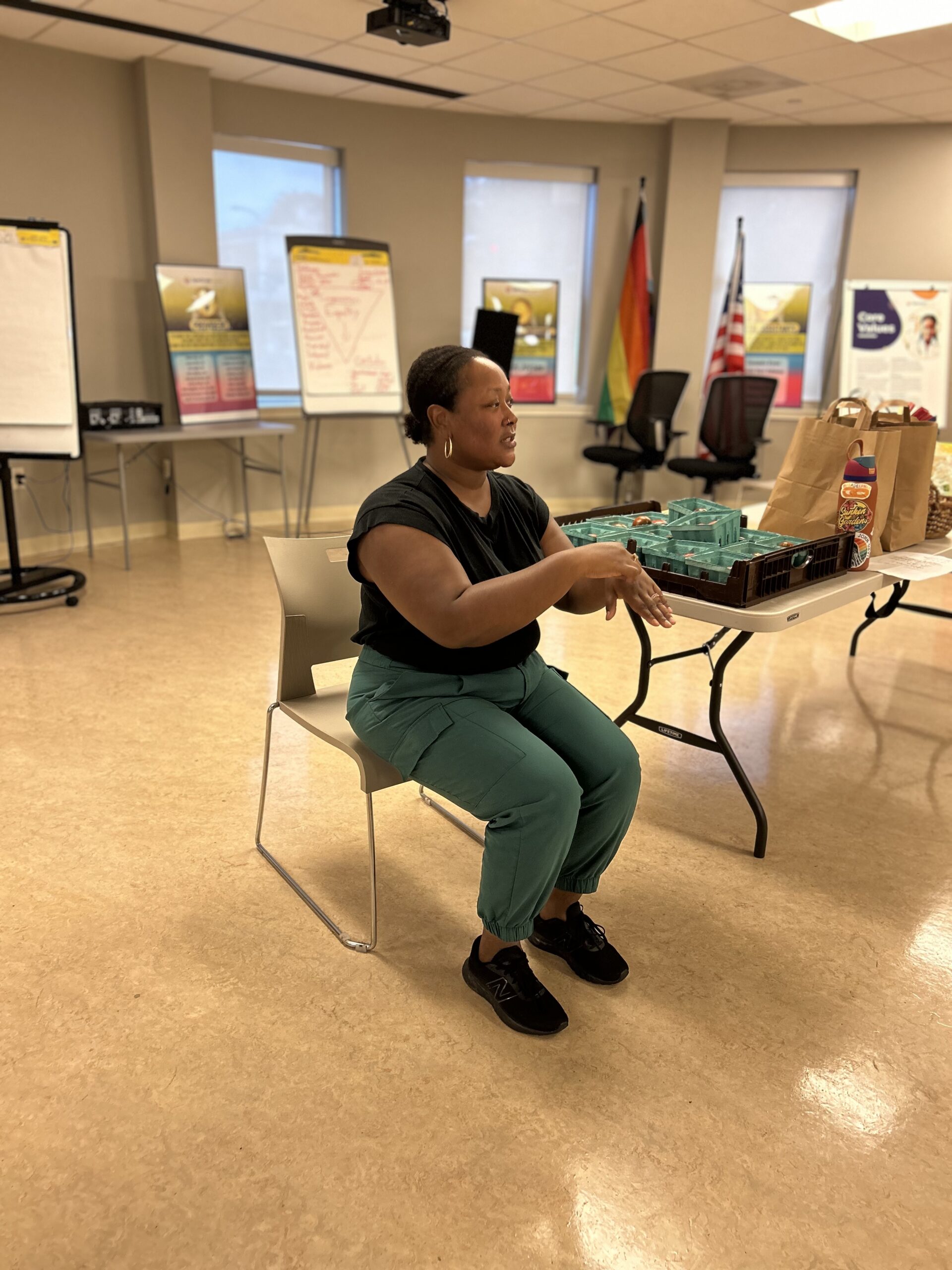 A woman takes part in a seated exercise
