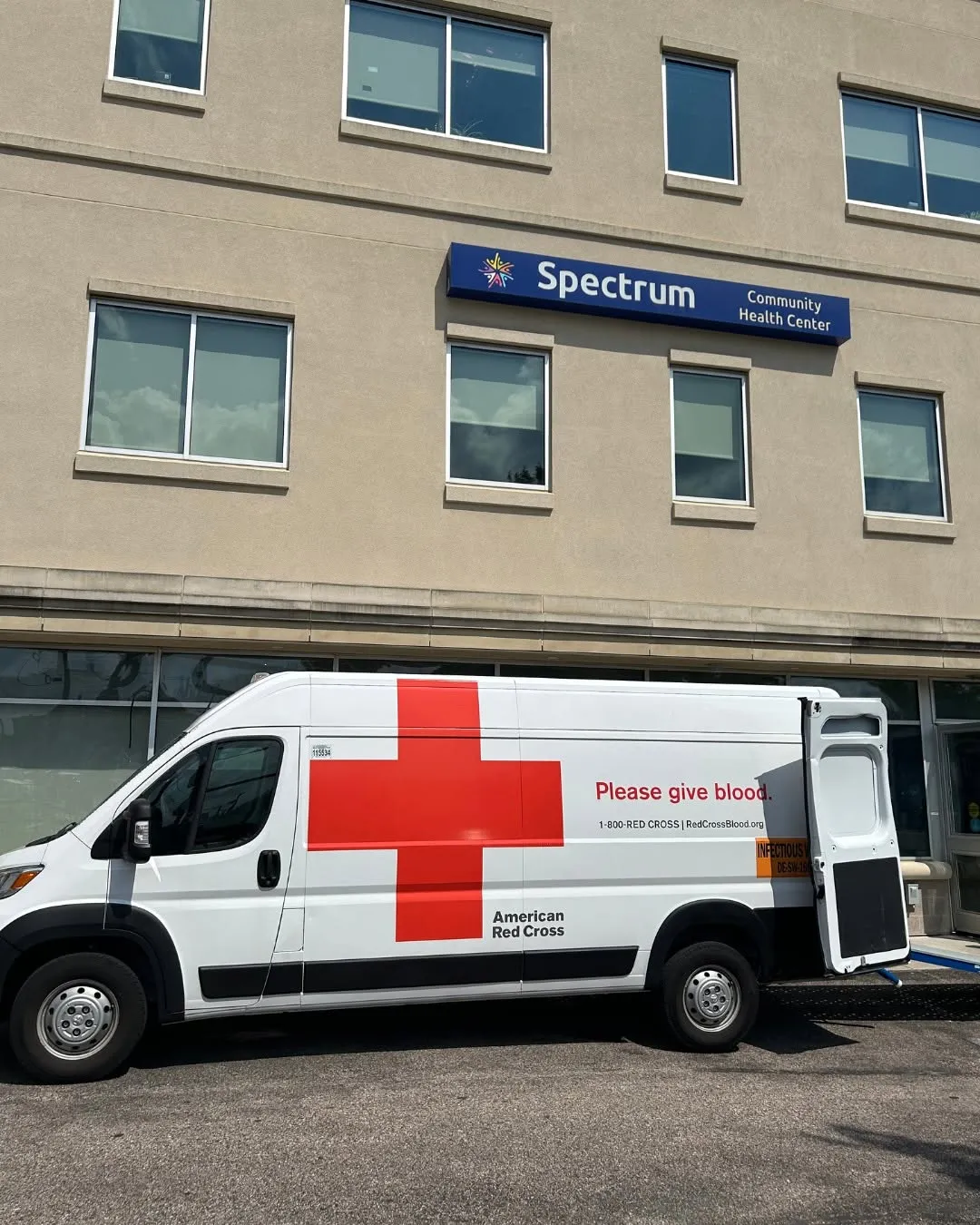 An American Red Cross van parked outside the Spectrum Health building.