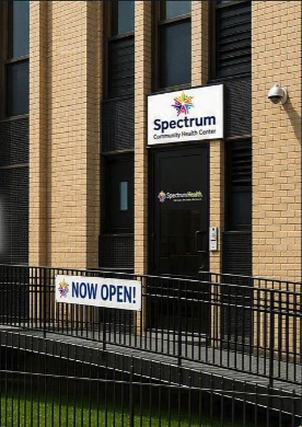 The new Spectrum Vaux Community Health Center building with a Now Open banner